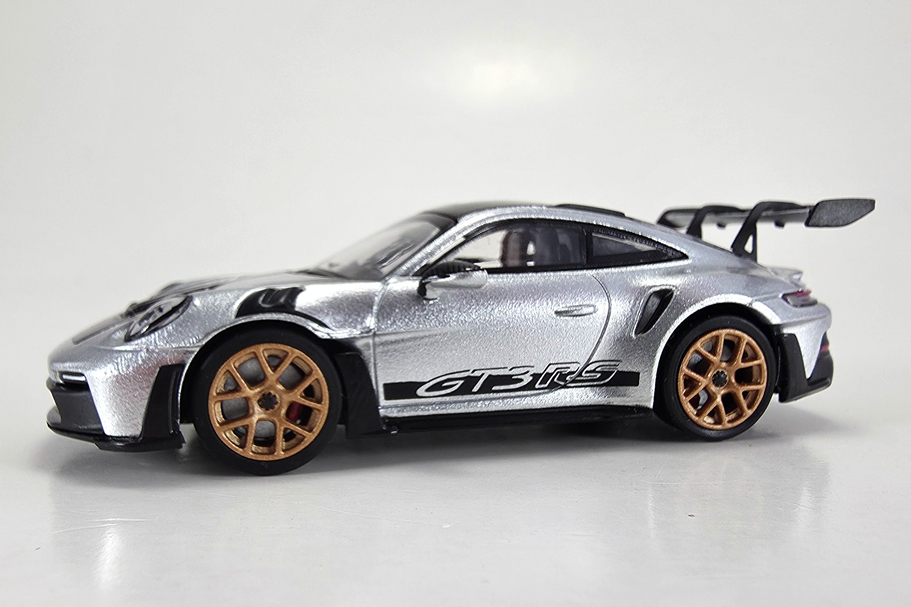 1:64 scale diecast Porsche 911 GT3 RS (992) by Minichamps | Left Front Quarter