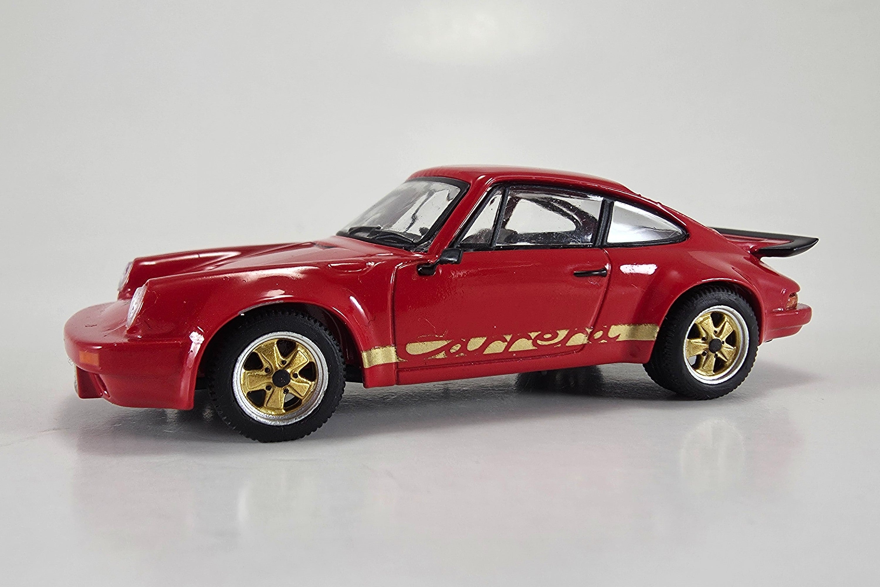 1:64 Scale Model Porsche 911 Carrera RS 3.0 (1974) by Spark | Front Quarter